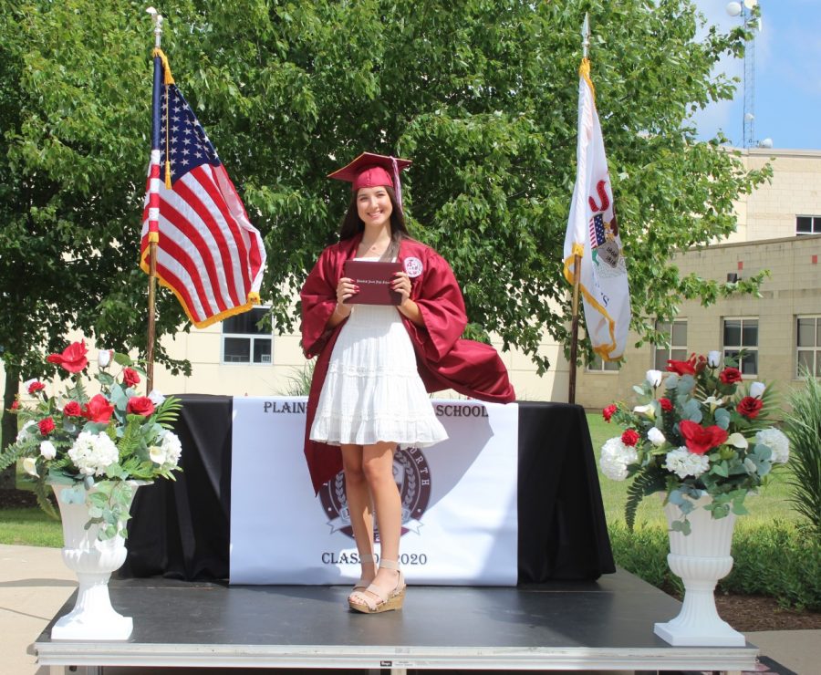 Sydney+Allen+receives+her+diploma+at+the+Drive-through+Graduation+on+Friday%2C+July+17%2C+2020.+Drive-through+Graduations+were+held+in+place+of+traditional+in-person+graduations+which+were+cancelled+due+to+the+COVID-19+pandemic.