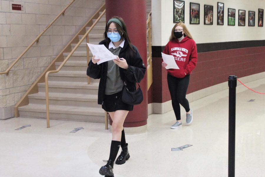 Two Plainfield North High School freshman follow their schedules to find their classes during Freshman Open House on Wednesday, January 28, 2021. District 202 freshman return to in-person learning on Monday, February 1, 2021