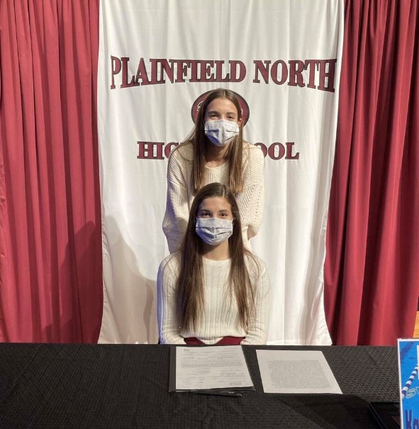 Swimmer Karley Sonennberg poses with her sister, Kendyl, during National Signing Day on Nov. 11