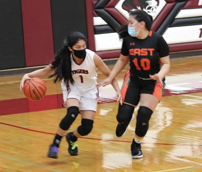 Senior guard Beatrice Atienza escapes a defender in a game against Plainfield East.