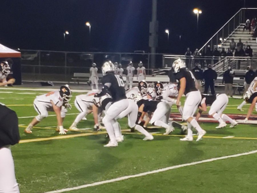 Photos of PNHS Tigers Football Team and Oswego East Panthers.