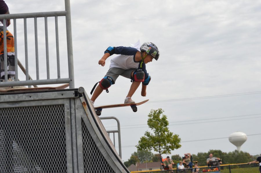 A young skateboard enthusiast displays his skills at a contest held at Bott Community Park and hosted by Jerics Skateshop