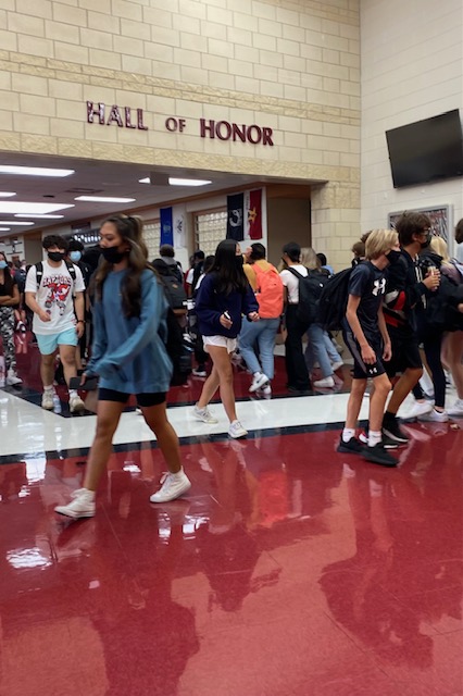 Students fill halls and take on another crowded passing period. The 2021-2022 school year begins with in-person learning. Safety Protocols enforced by administration and staff. Photo by Julia Gerard