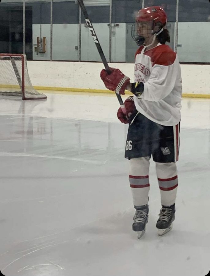 Junior captain Alex Barlog warms up before game against the DuPage Stars on Nov. 20. Photo courtesy of Annalise Barlog
