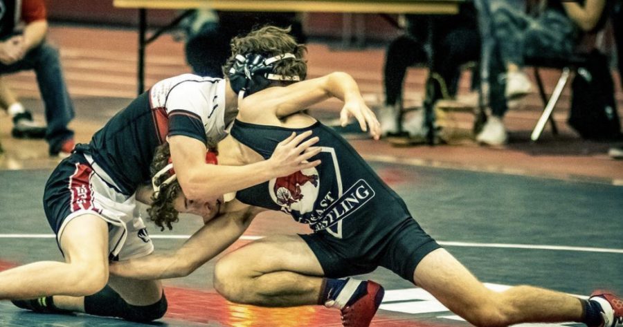 Sophomore+Danny+Dimartino+%28left%29+competes+against+a+Glenbard+East+opponent+%28right%29+at+the+North+Quad+on+Nov.+24.+Photo+courtesy+of+Piton+Media