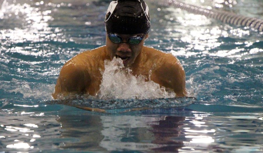 Junior Ian Mallari competes as meets throughout the Plainfield boys swimming team season. Photo by Madi Boor