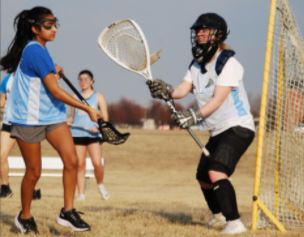 Sophmore Aanya Krishan and senior Katie Schudiske scrimmage at practice. Photo by Jillian Schudiske