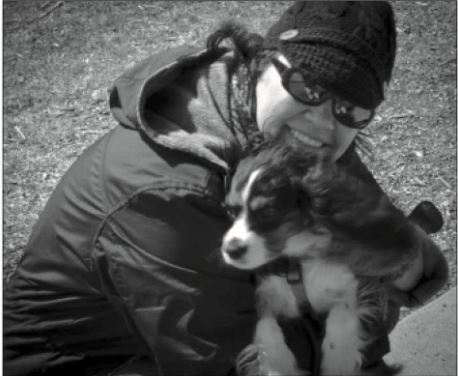 English teacher Jennifer McDowell cuddles Watson- one of her Cavalier King Charles Spaniels. Photo courtesy of Andy McDowell.