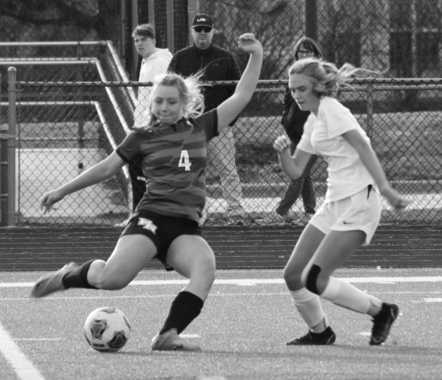 Sophomore Lauren Mrugala takes a shot against Minooka on March 14.

Photo by Mary Henry
