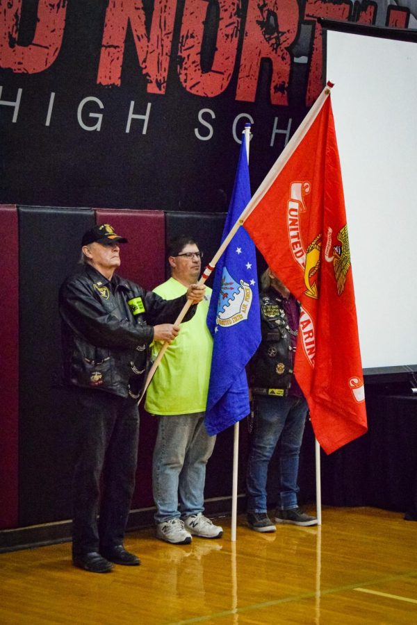 Flags are raised by our honored veterans.