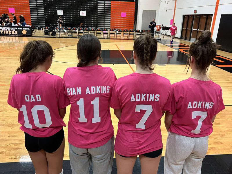Byline- North players join sophomore Kaelynn Adkins in honoring her father Ryan Adkins, who passed away on July 15.