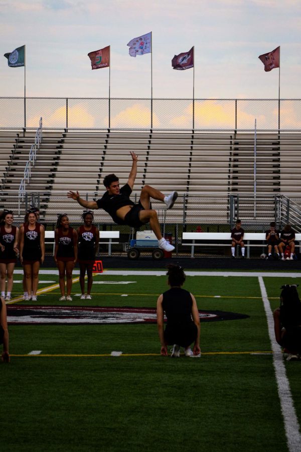 Max Newman shows off his gymnastics skills before a game.