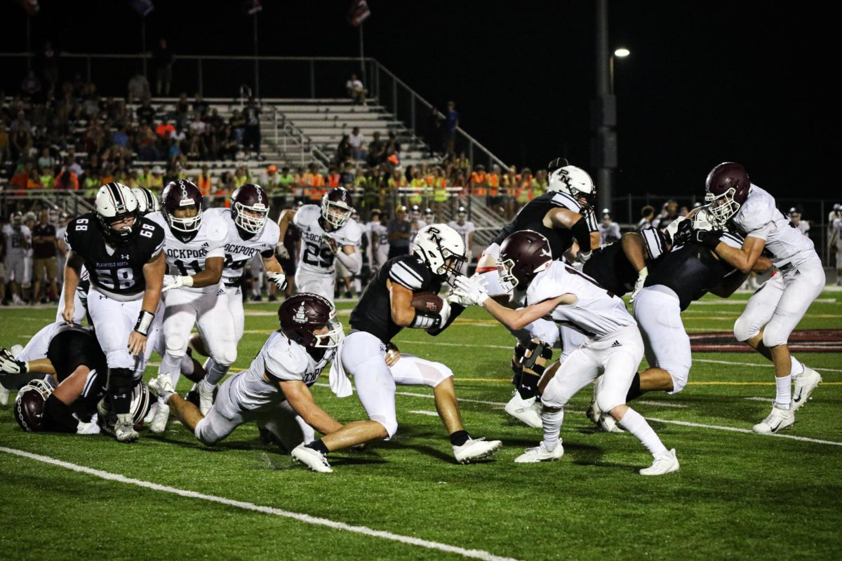 Senior captain Eli Liapis evades a defensive back against the Porters.