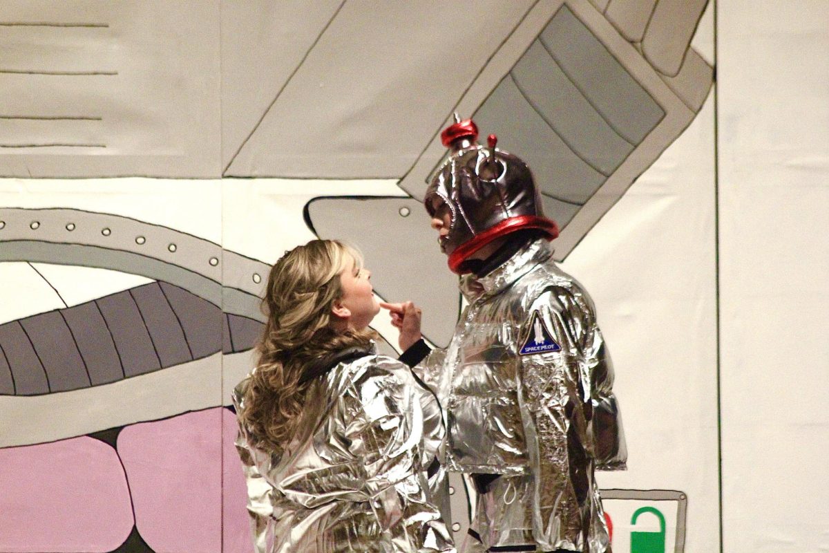 Senior Ella Schuler and sophomore Lily Pyatt perform as Tybalt and Romeo in outer space during a scene from "Lucky Spark".