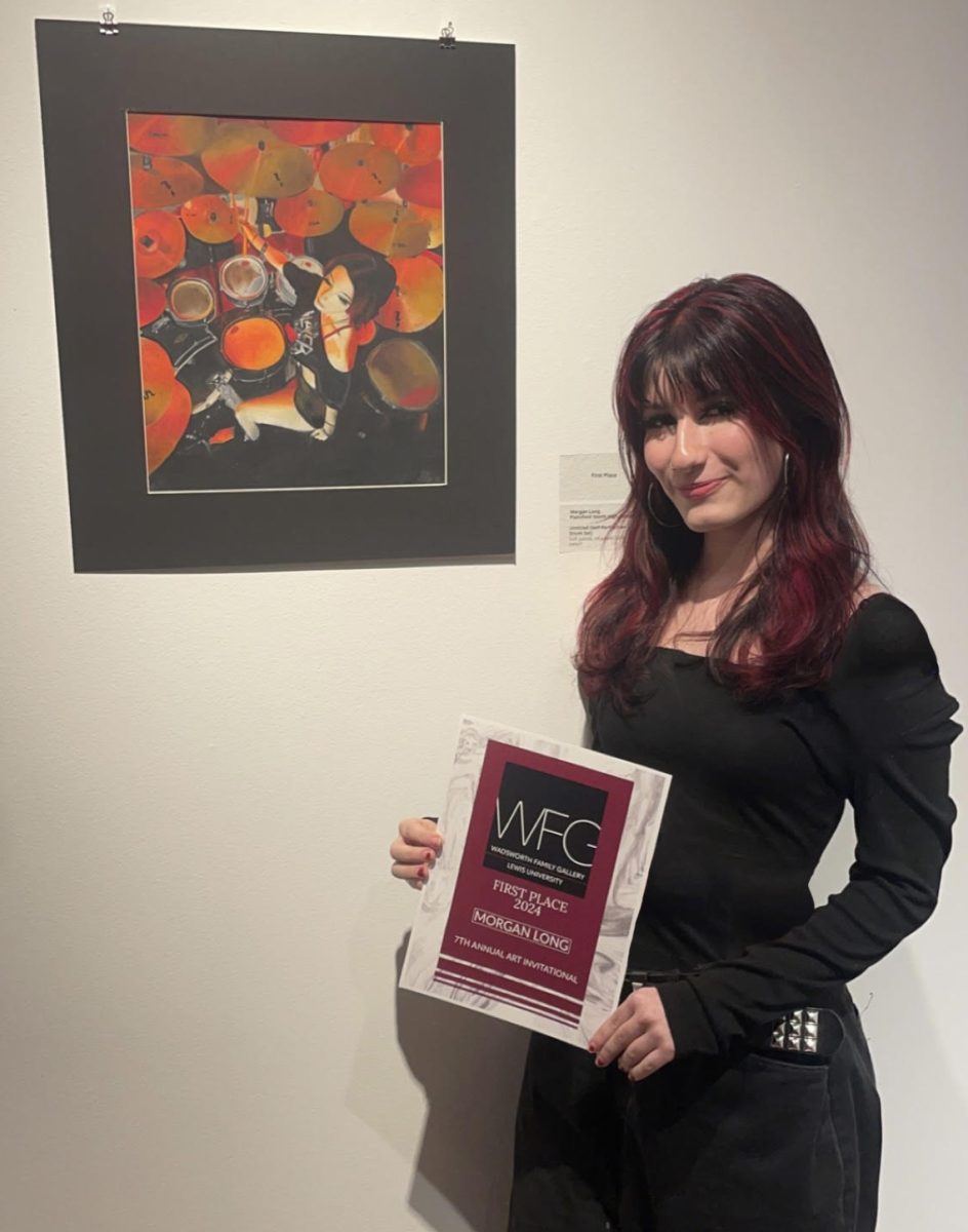 Sophomore Morgan Long earns Best-in-show with her award-winning color pencil self-portrait at Lewis University's Art Invitational.